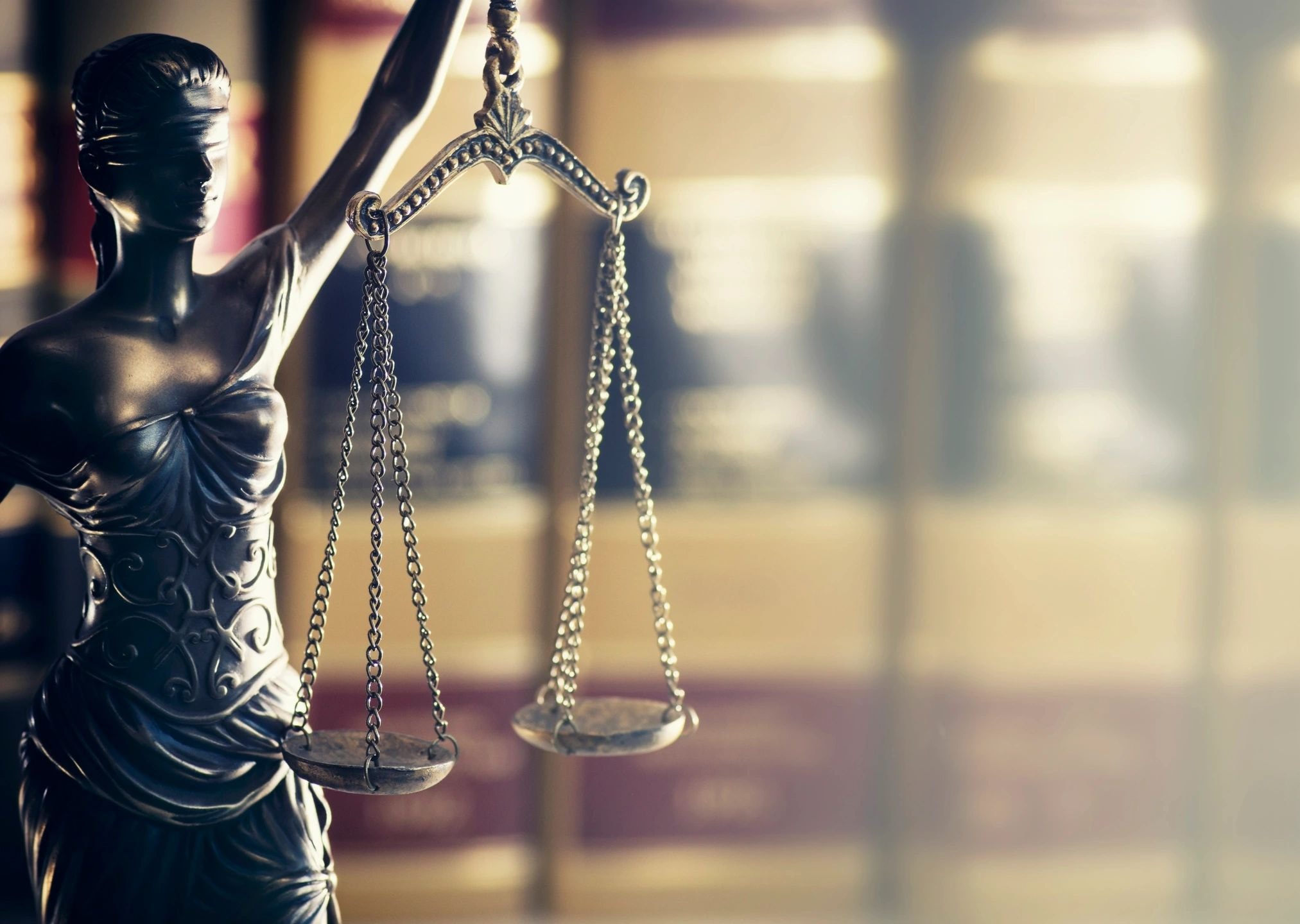 Scales of justice representing McLaughlin & Wilshinsky, P.C.